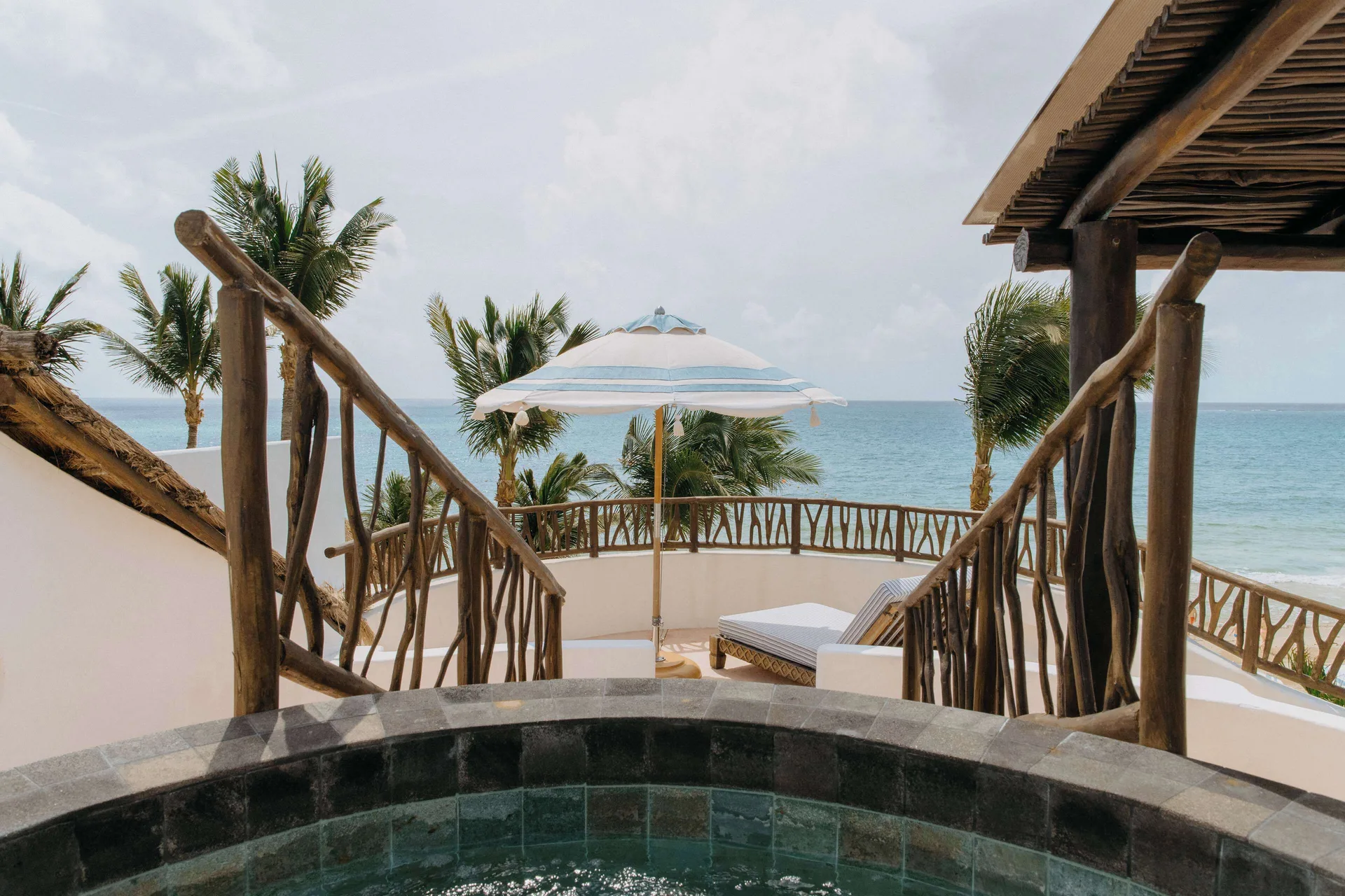 Terrace plunge pool, daybed, and ocean view at Maroma, Riviera Maya.