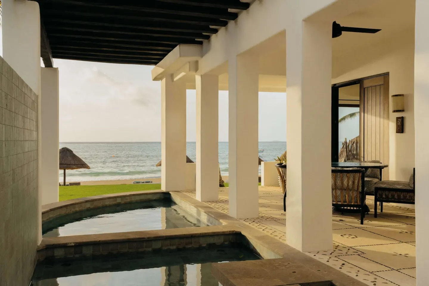 Oceanfront terrace with plunge pools, columns and seating at Maroma, Riviera Maya.