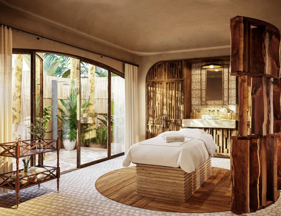 Spa treatment room with massage bed and garden doors at Maroma, Riviera Maya.