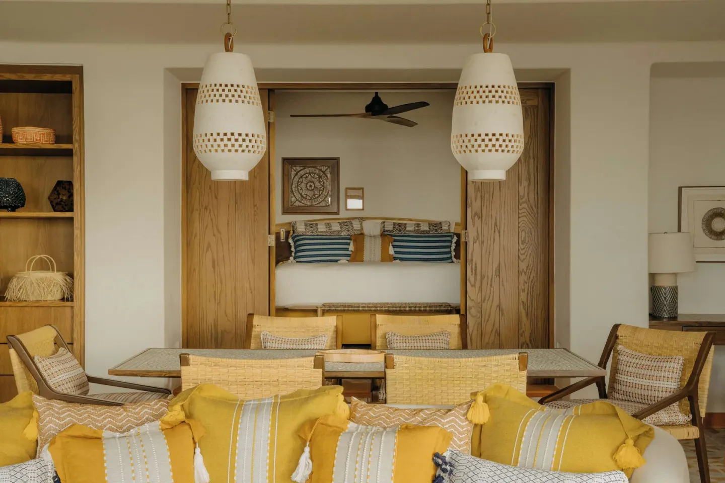 Suite living area with a king bed visible beyond at Maroma, Riviera Maya.