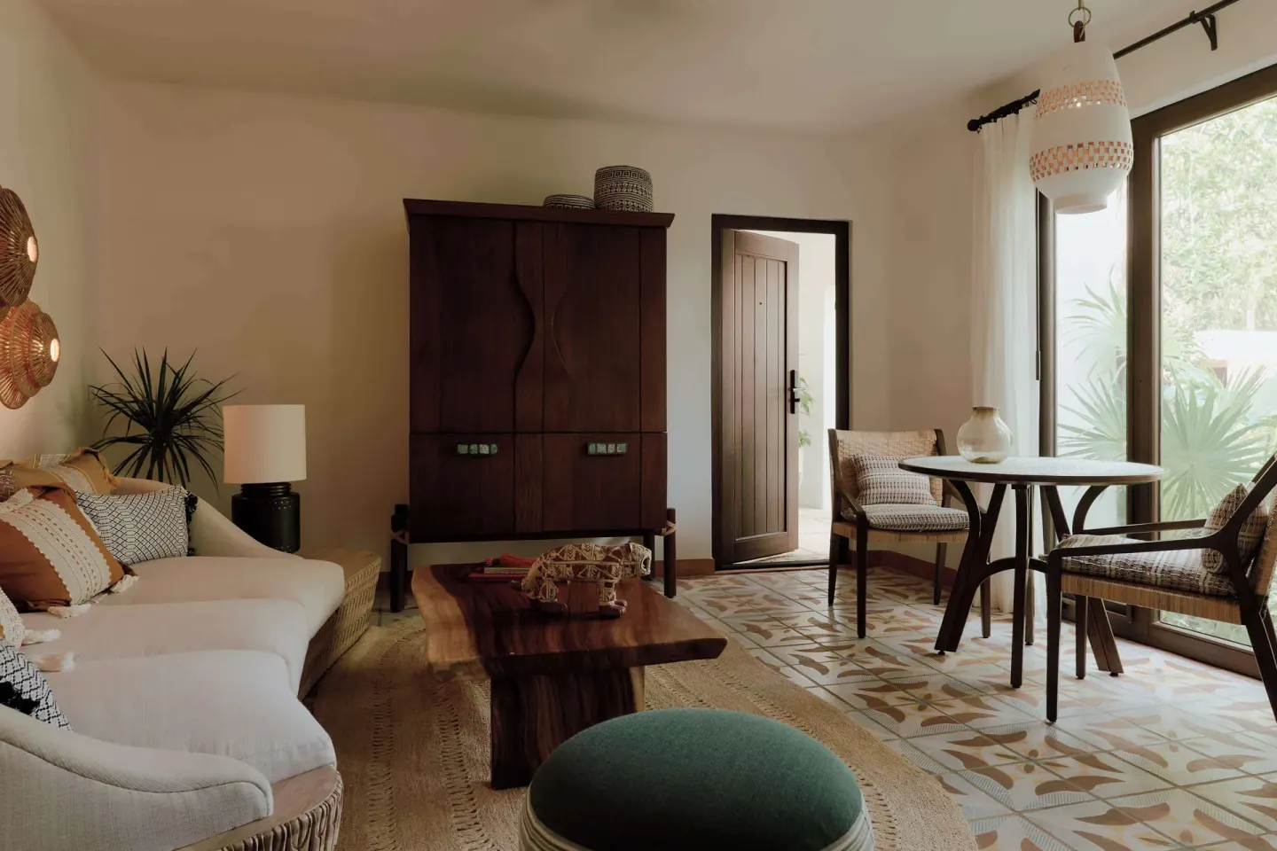 Garden View Premium Suite living area at Maroma, Riviera Maya with sofa, table, and garden light.