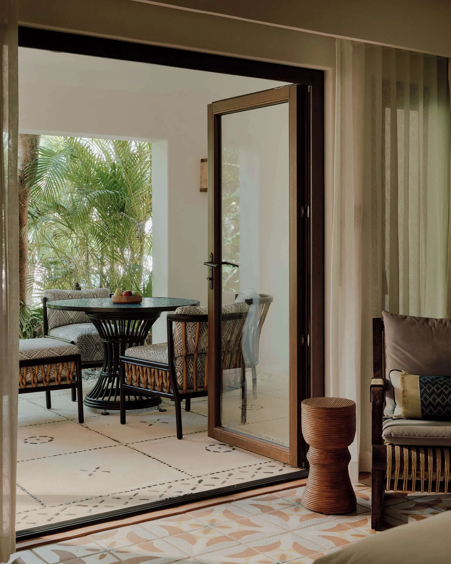 Garden View Premium Suite terrace seating at Maroma, Riviera Maya with palms outside.