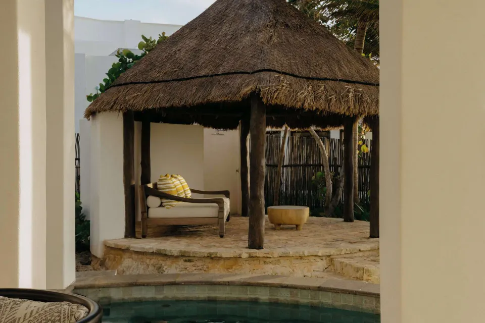 Oceanfront suite plunge pool beside a thatched pavilion at Maroma, Riviera Maya.