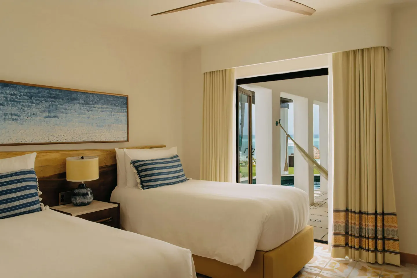 Oceanfront suite twin bedroom opening to terrace at Maroma, Riviera Maya.