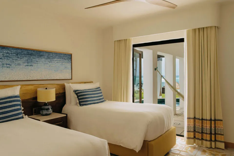 Oceanfront suite twin bedroom opening to terrace at Maroma, Riviera Maya.