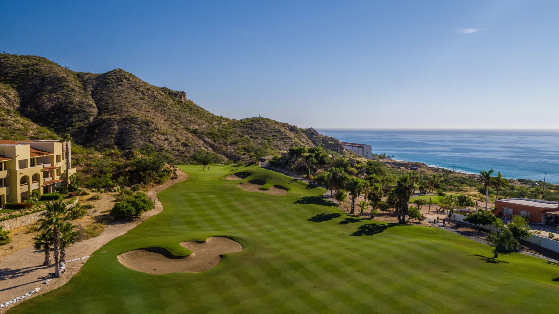 Golf fairway with sand bunkers and ocean beyond near Marquis Los Cabos.