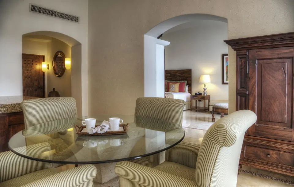 Master Suite dining area with bedroom beyond at Marquis Los Cabos.