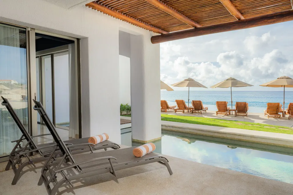 Ocean View Casita patio with lounge chairs beside a plunge pool at Marquis Los Cabos.