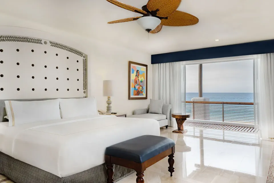 Oceanfront Casita king bedroom with balcony and ocean view at Marquis Los Cabos.