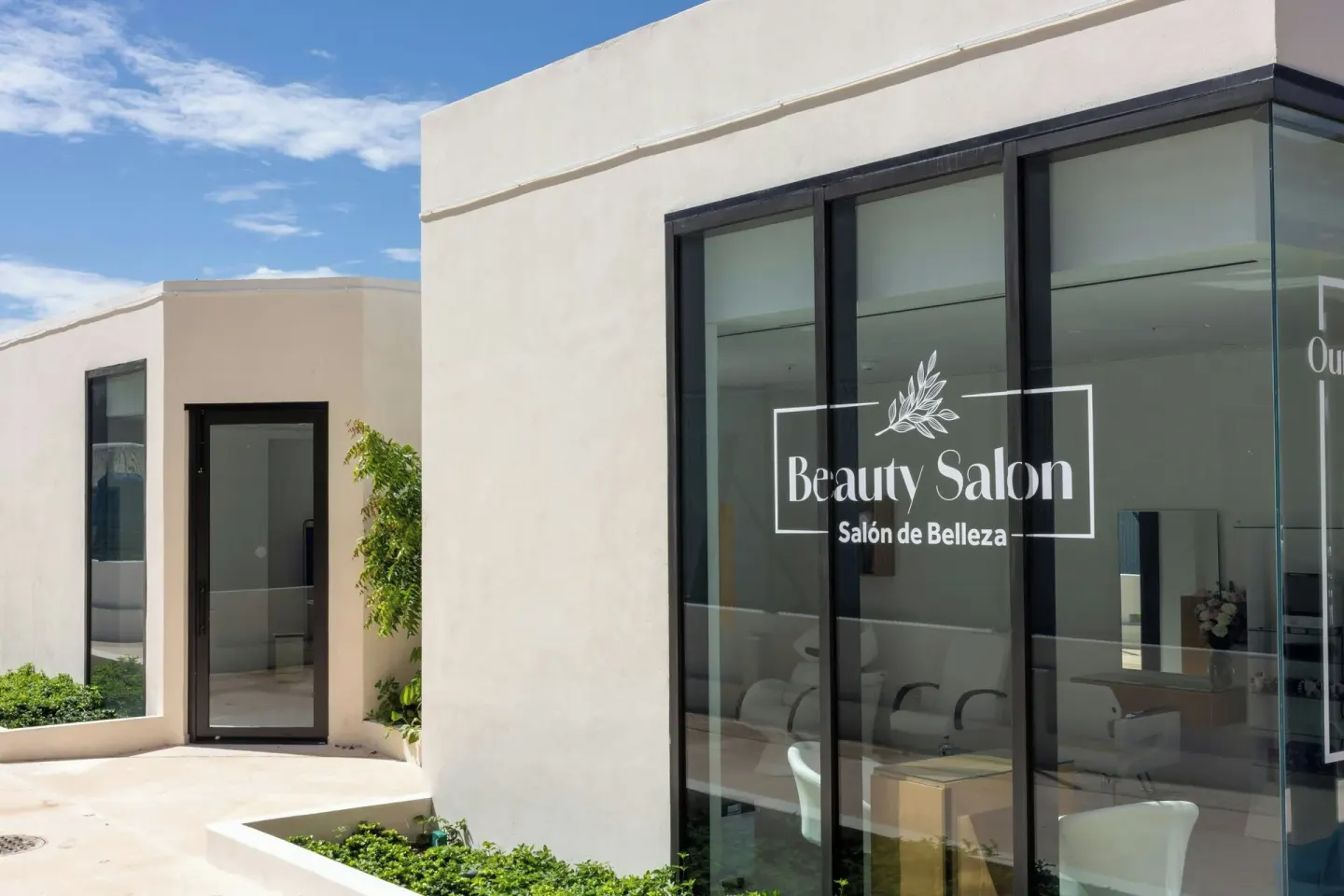 Beauty salon storefront with glass windows and signage at Marriott Cancun.
