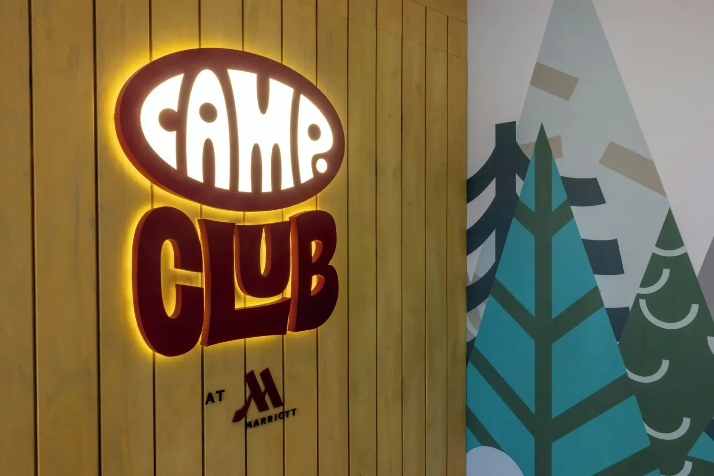 Camp Club wall sign and tree mural at Marriott Cancun.