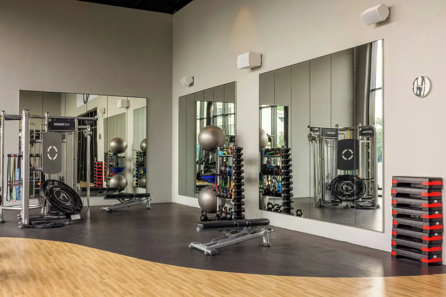 Fitness studio with mirrors, weights and resistance equipment at Marriott Cancun.