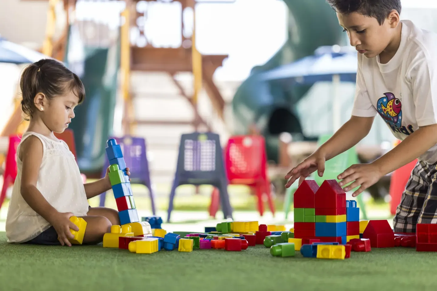 Children build with colorful blocks in the kids' play area at Marriott Cancun.
