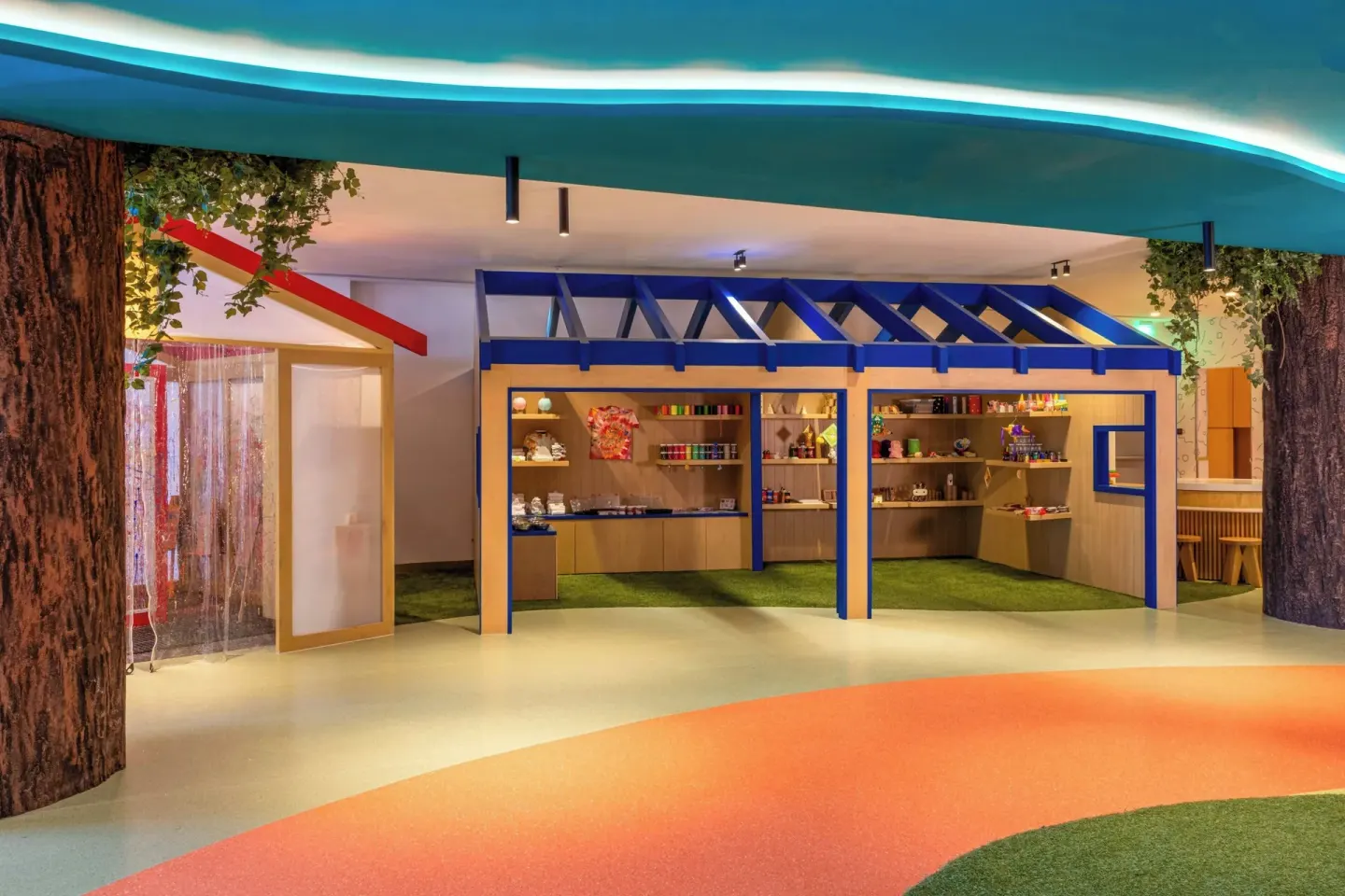 Kids' club activity area with display shelves and colorful flooring at Marriott Cancun.