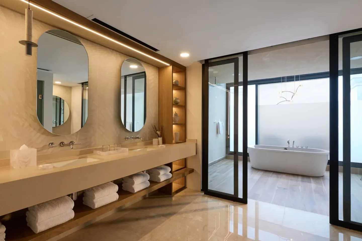 Presidential Suite bathroom with double vanity and freestanding tub at Marriott Cancun.