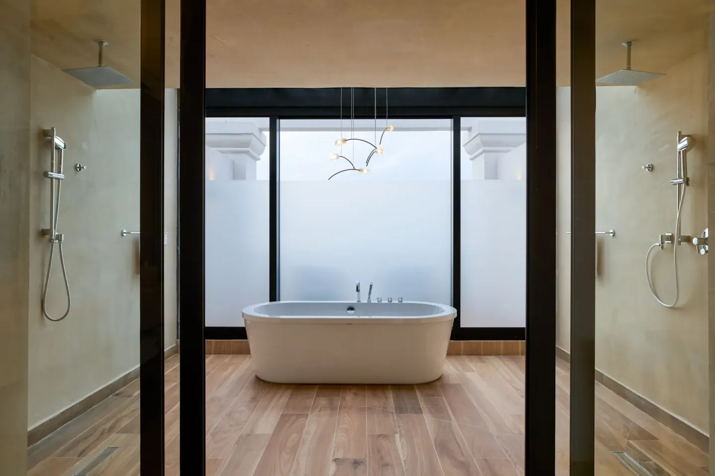 Presidential Suite bathroom with soaking tub and twin showers at Marriott Cancun.