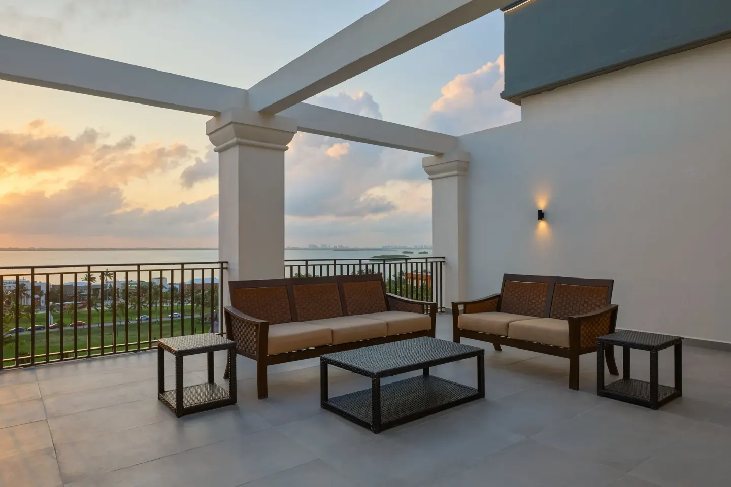 Presidential Suite terrace seating at sunset with lagoon view at Marriott Cancun.