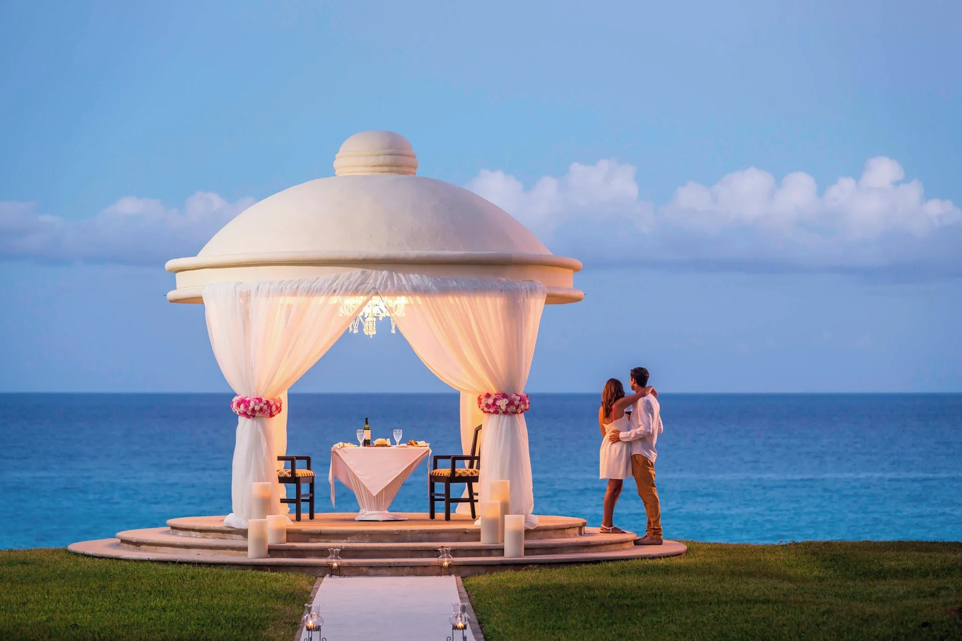 An oceanfront gazebo set for a private dinner at Marriott Cancun.