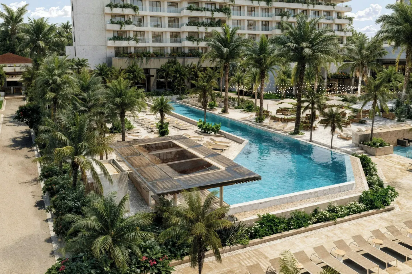 Aerial view of the pool, palms and loungers at Marriott Puerto Vallarta Resort & Spa.