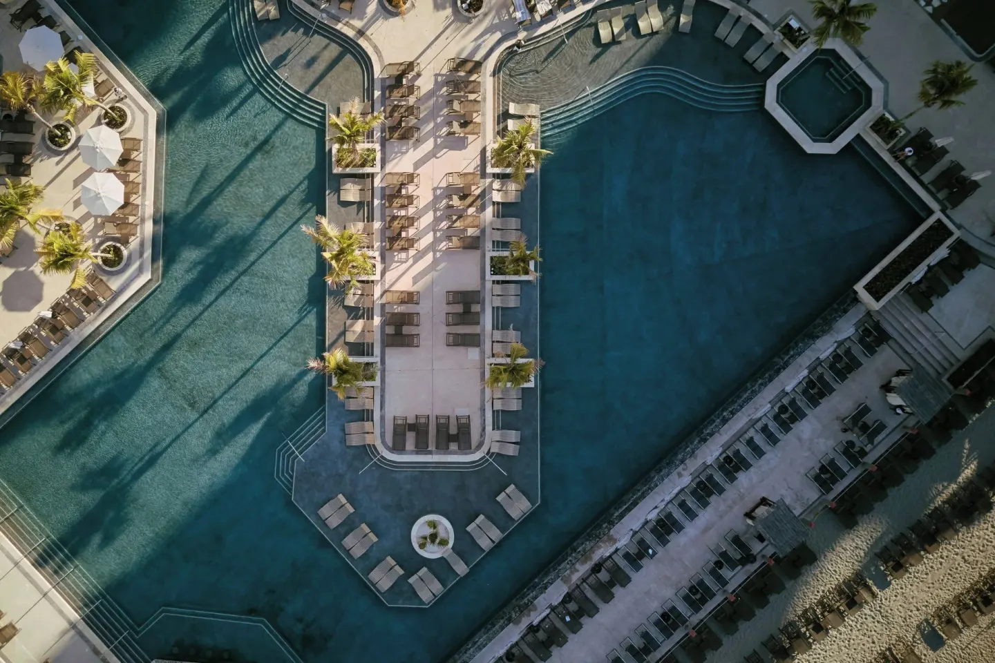 Aerial view of pools and beach loungers at Marriott Puerto Vallarta Resort & Spa.