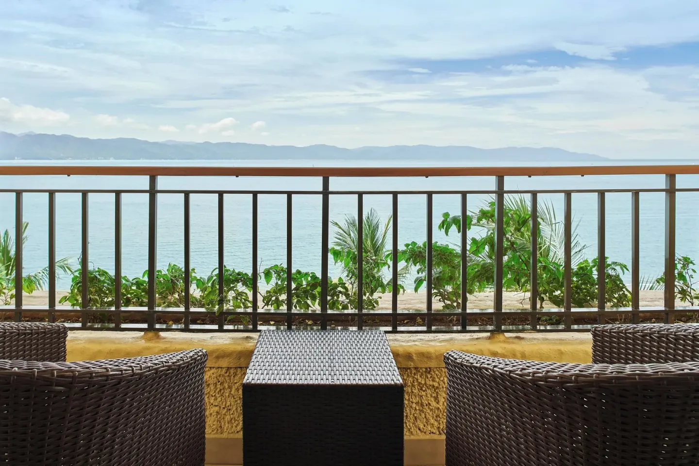Balcony table and chairs overlooking the bay at Marriott Puerto Vallarta Resort & Spa.