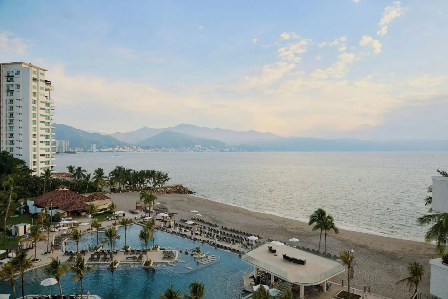 Beachfront pool and bay view at Marriott Puerto Vallarta Resort & Spa.