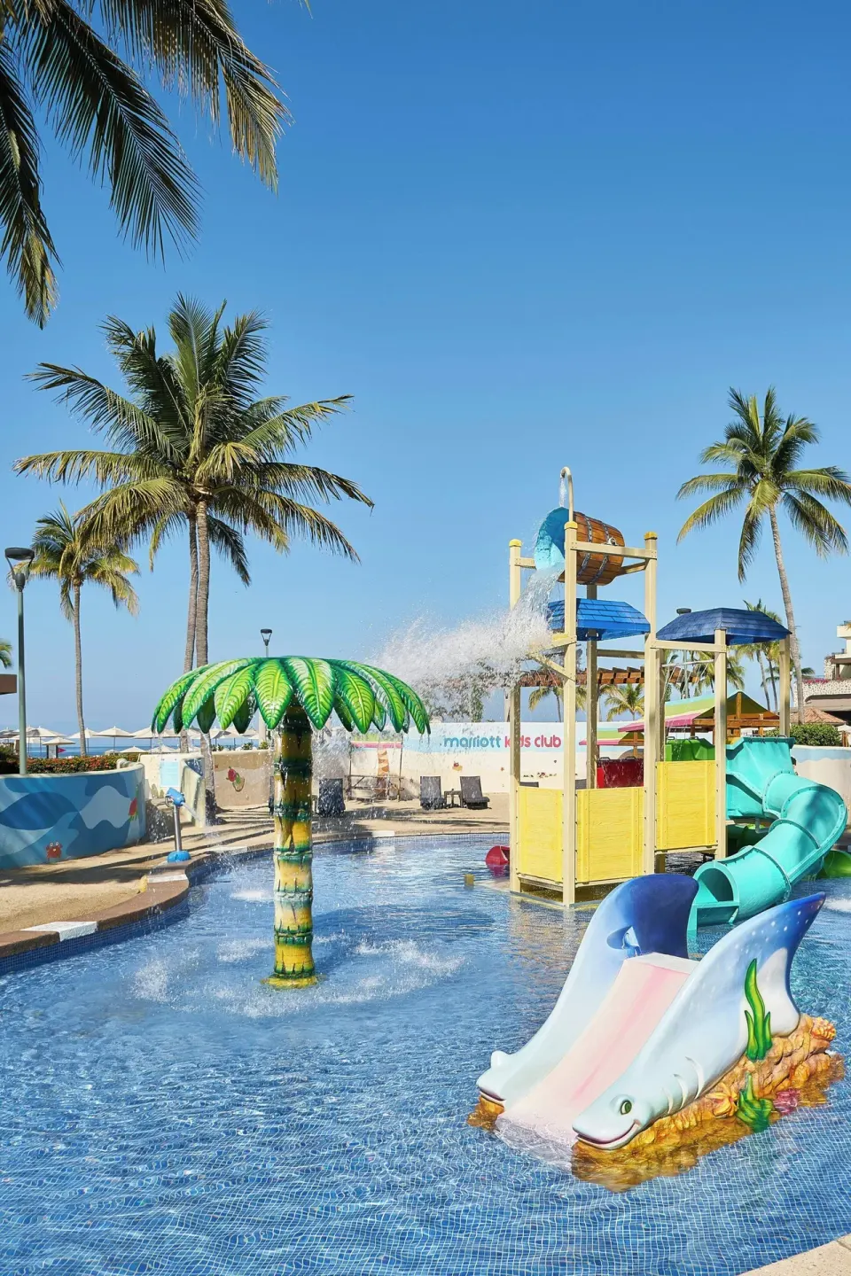 Children's splash pool with slides and water features at Marriott Puerto Vallarta Resort & Spa.