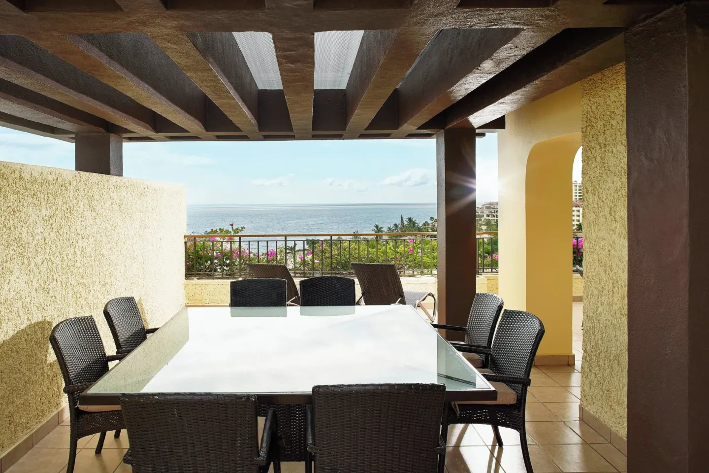 Covered terrace dining table with ocean view at Marriott Puerto Vallarta Resort & Spa.