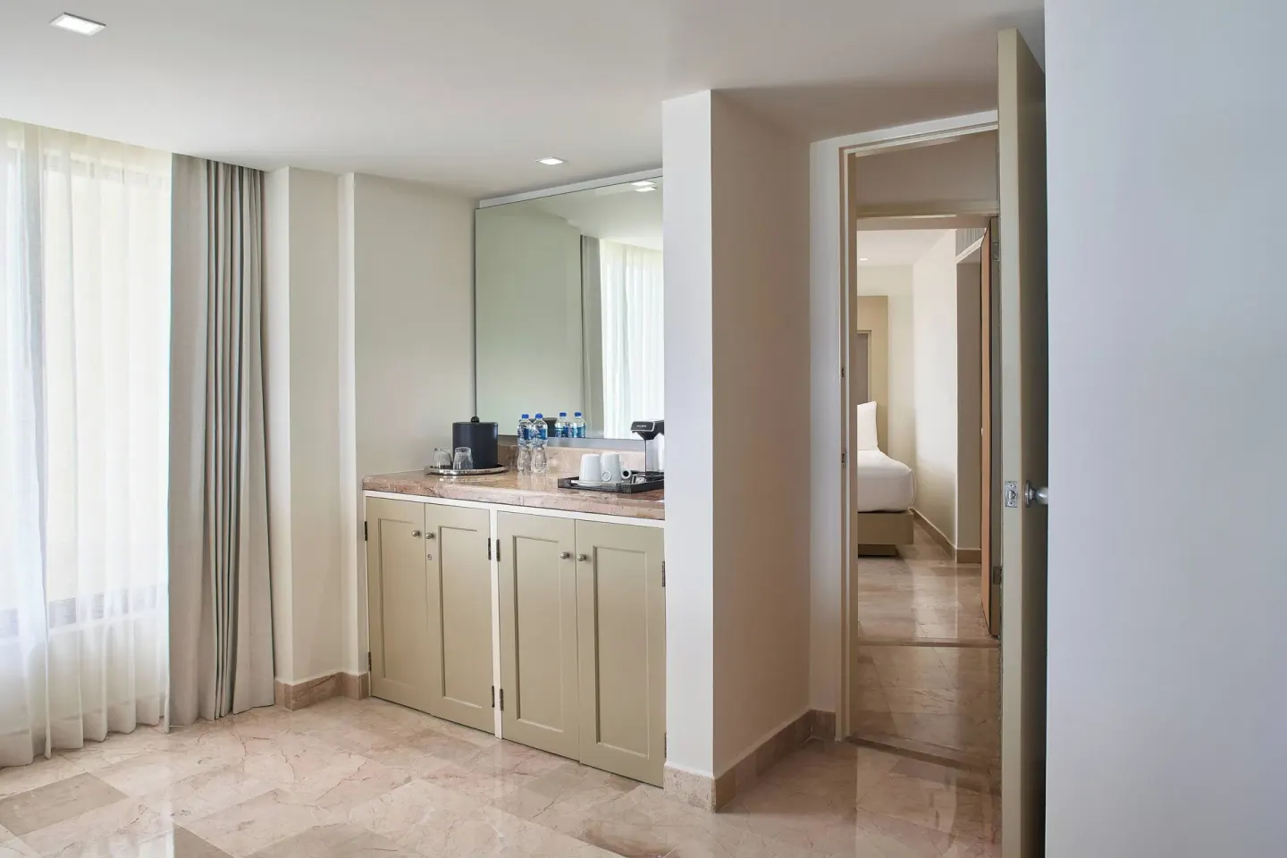Guest room refreshment counter and doorway at Marriott Puerto Vallarta Resort & Spa.