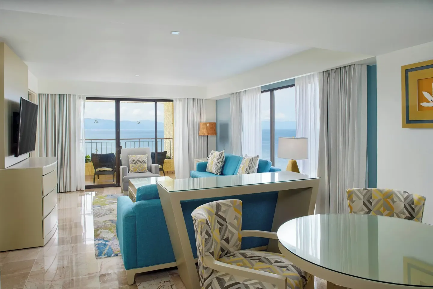 Suite living area with balcony ocean view at Marriott Puerto Vallarta Resort & Spa.