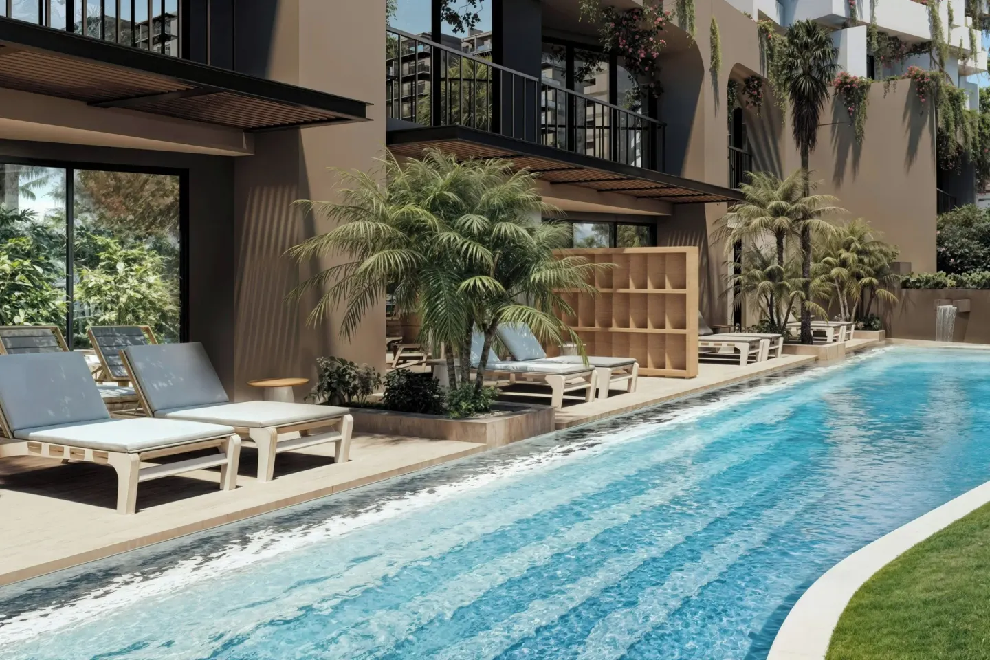 Poolside lounge chairs and palms by guest balconies at Marriott Puerto Vallarta Resort & Spa.