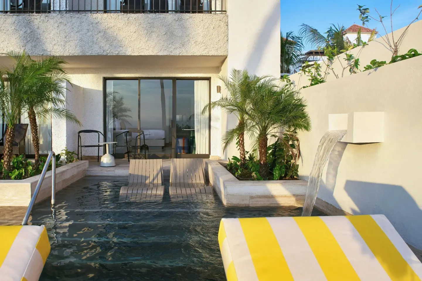 Private pool terrace with waterfall feature at Marriott Puerto Vallarta Resort & Spa.