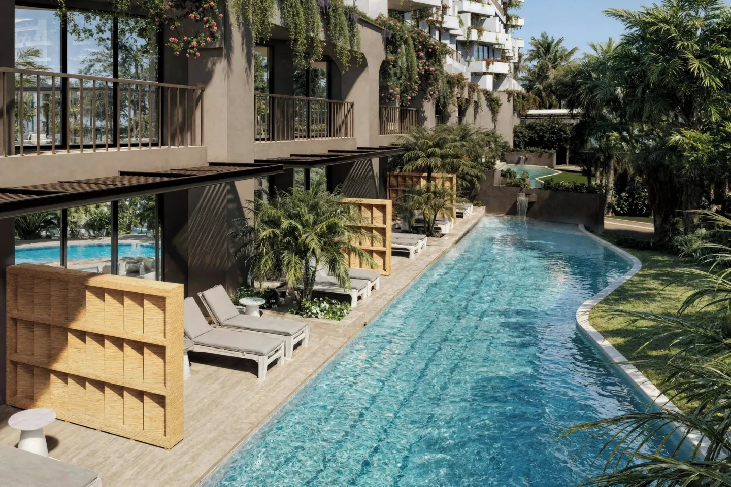 Swim-up pool area with loungers and balconies at Marriott Puerto Vallarta Resort & Spa.