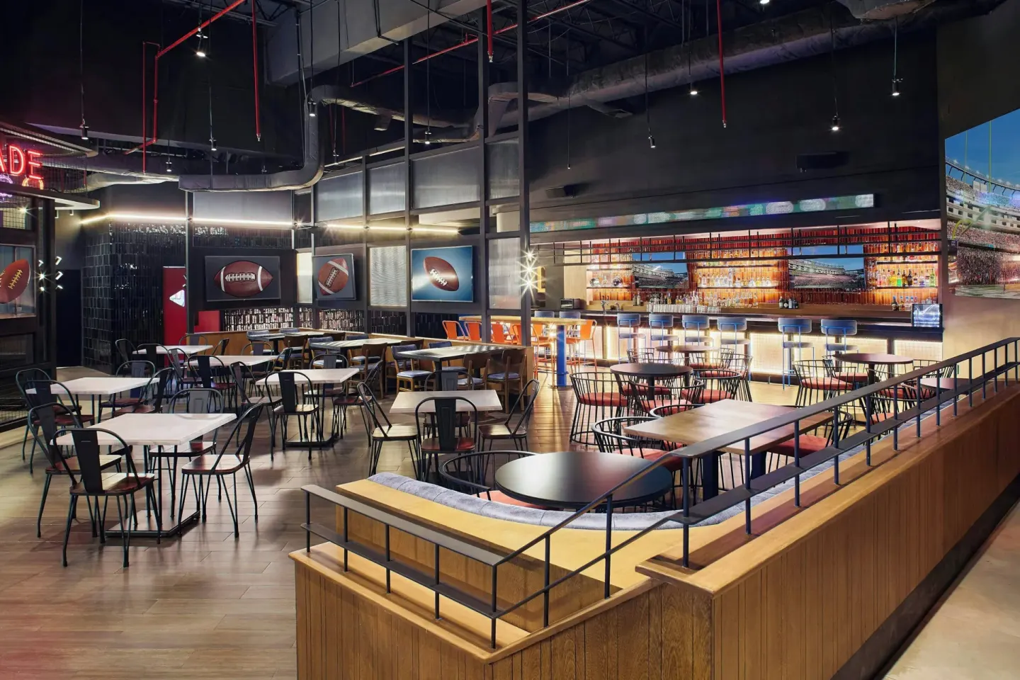 Sports bar dining room with tables, screens and a long bar at Marriott Puerto Vallarta Resort & Spa.