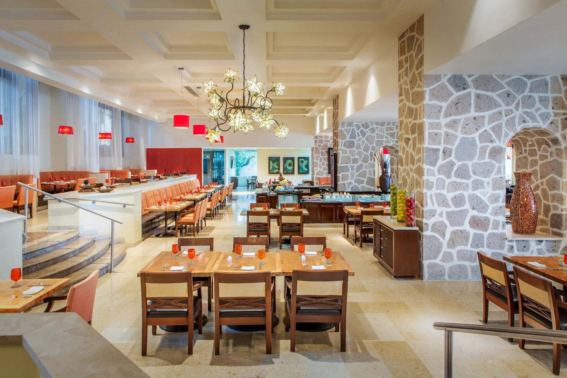 Dining room with buffet counters and red accents at Marriott Puerto Vallarta Resort & Spa.