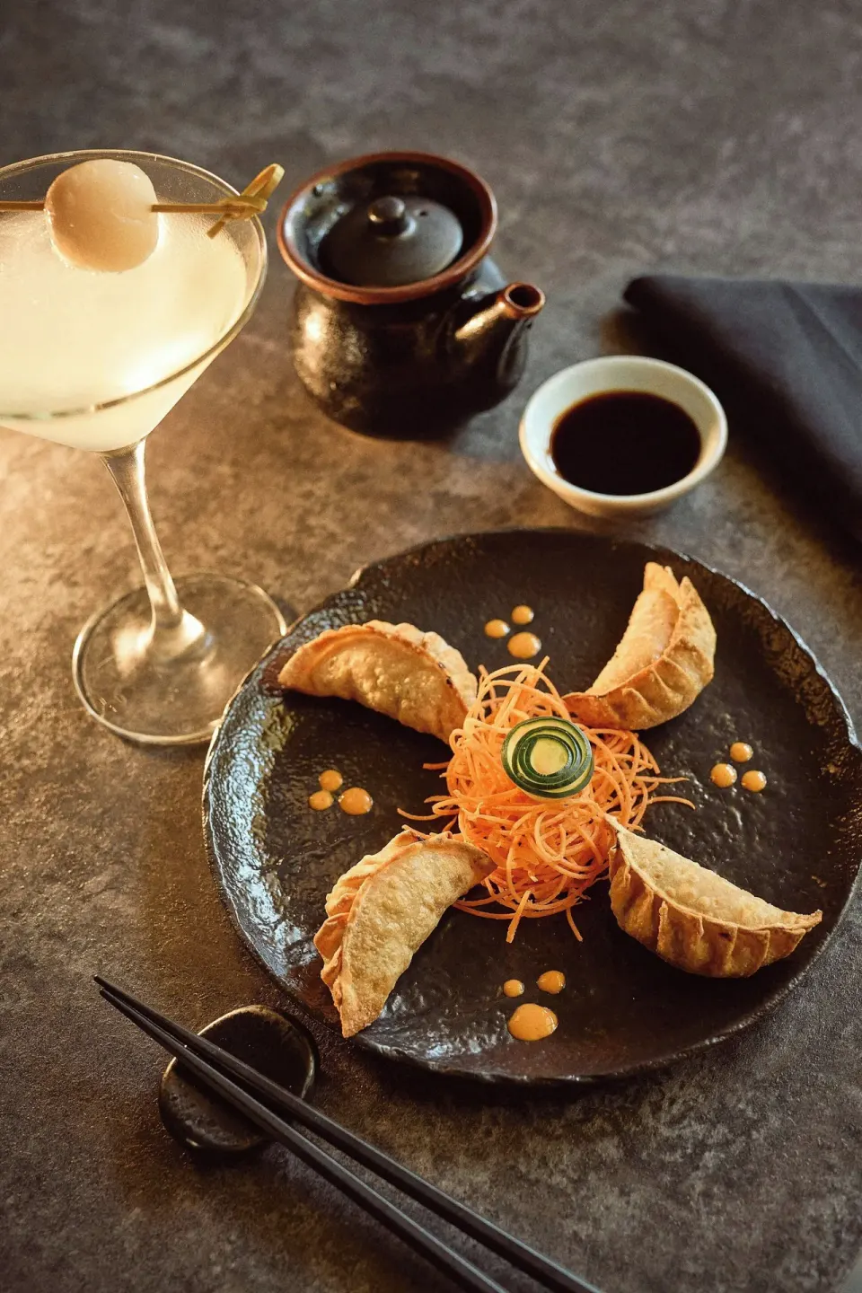 Dumplings with a cocktail, teapot and chopsticks at Marriott Puerto Vallarta Resort & Spa.