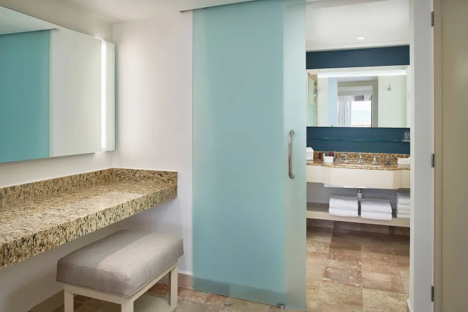 Luxury Suite vanity area with bathroom beyond at Marriott Puerto Vallarta Resort & Spa.