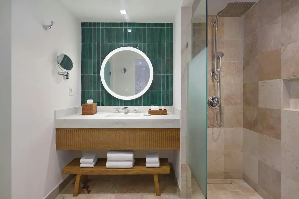 Bathroom vanity and glass shower in a Panoramic Room at Marriott Puerto Vallarta Resort & Spa.