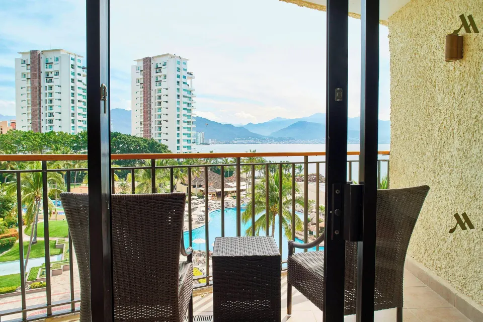 Panoramic Ocean View balcony with seating at Marriott Puerto Vallarta Resort & Spa.