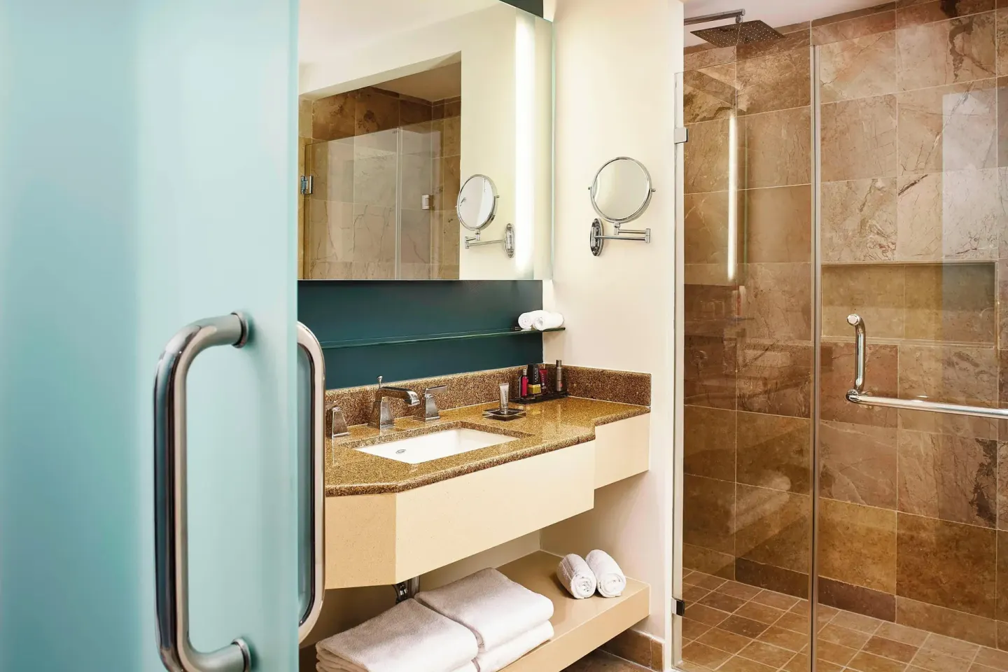 Panoramic Ocean View room bathroom at Marriott Puerto Vallarta Resort & Spa with vanity and shower.