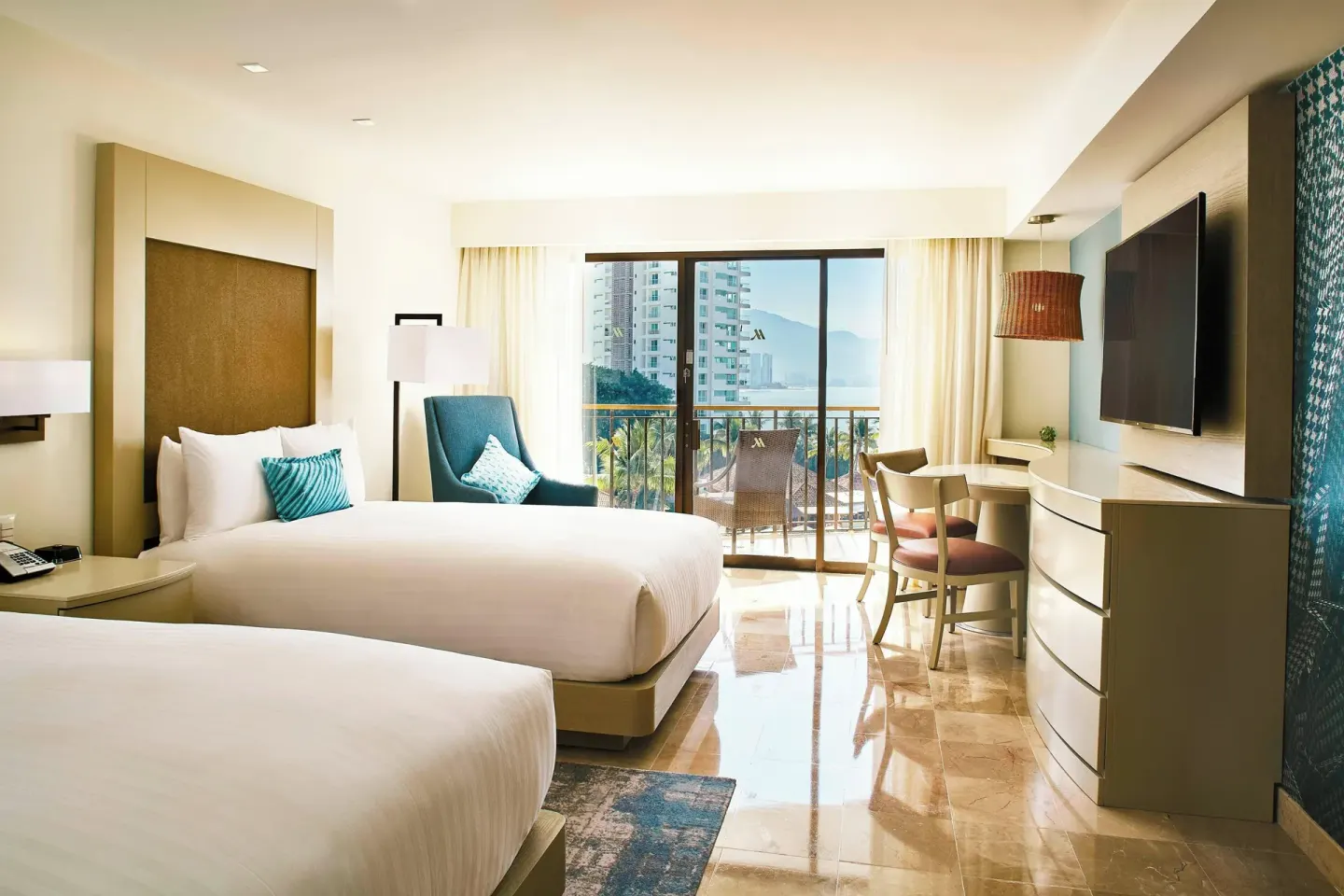 Panoramic Ocean View guest room with two beds at Marriott Puerto Vallarta Resort & Spa.