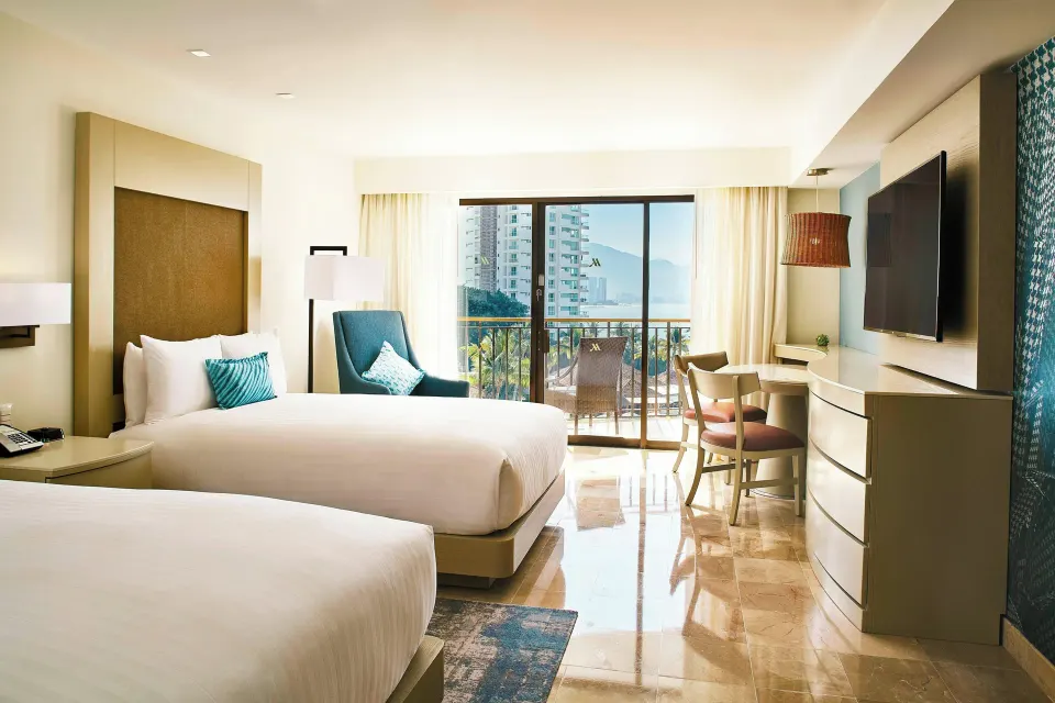 Panoramic Ocean View guest room with two beds at Marriott Puerto Vallarta Resort & Spa.