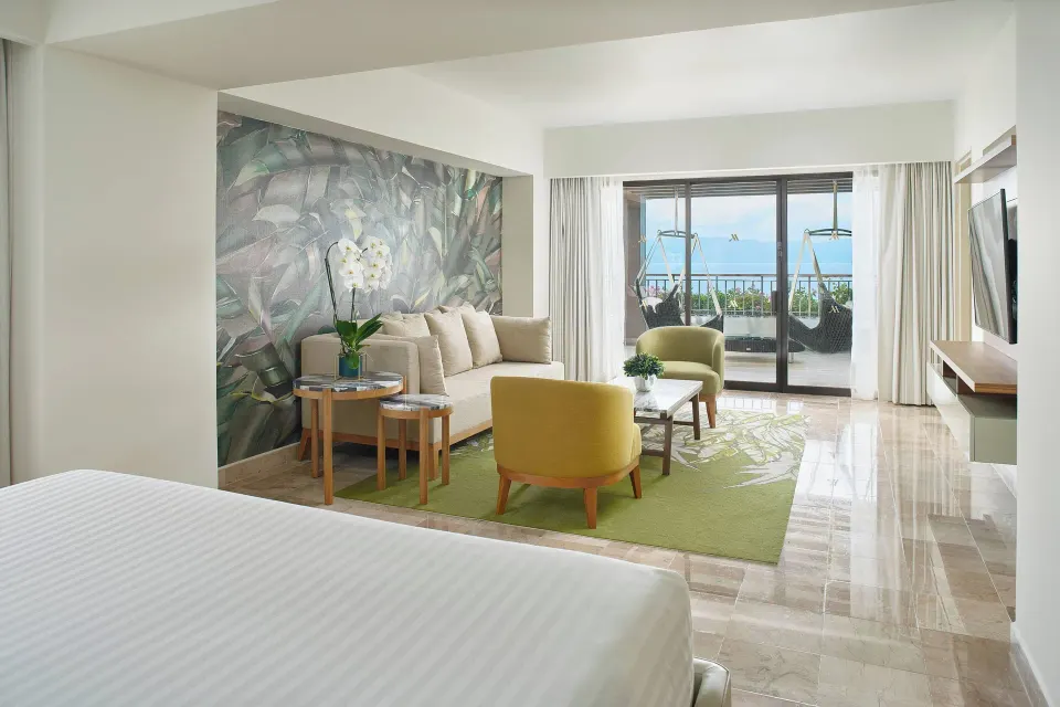 King bed and sitting area in the presidential suite at Marriott Puerto Vallarta Resort & Spa.