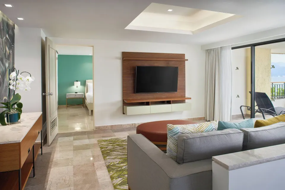 Presidential suite lounge with TV and terrace access at Marriott Puerto Vallarta Resort & Spa.