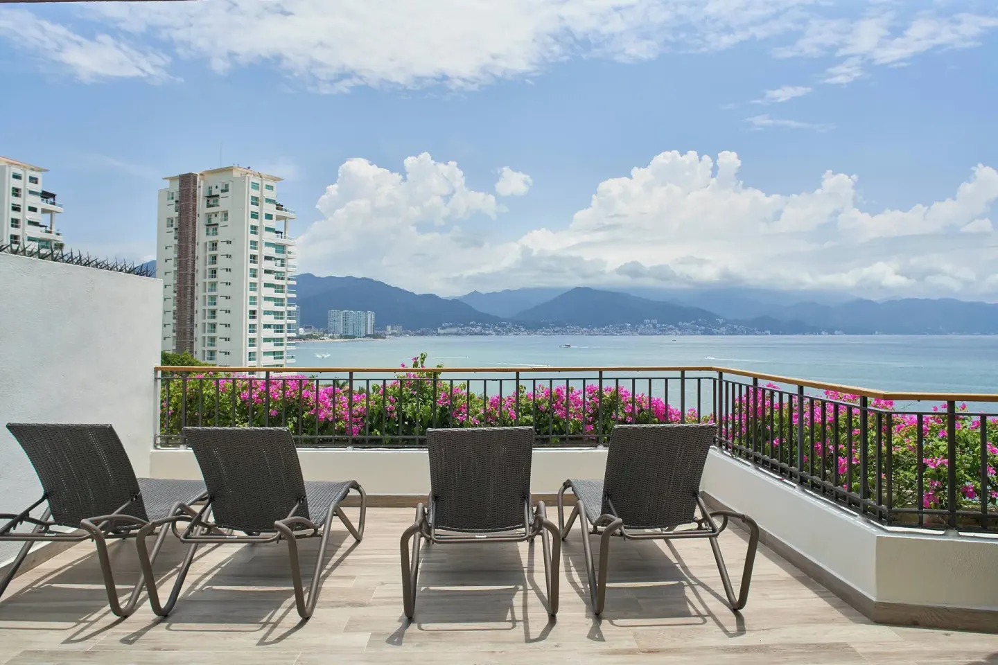Oceanfront terrace with lounge chairs at Marriott Puerto Vallarta Resort & Spa.