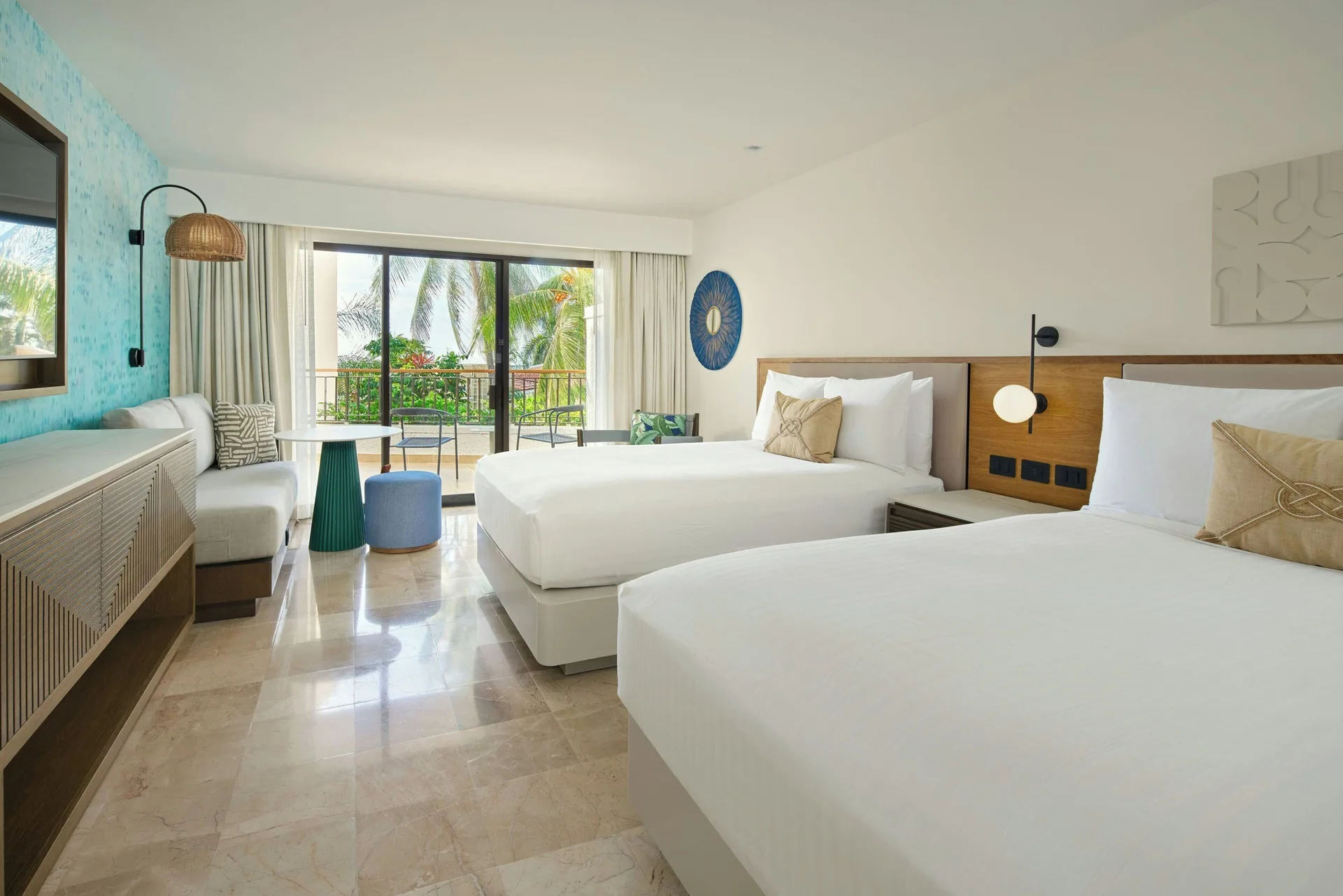 Garden View guest room with two beds and balcony at Marriott Puerto Vallarta Resort & Spa.