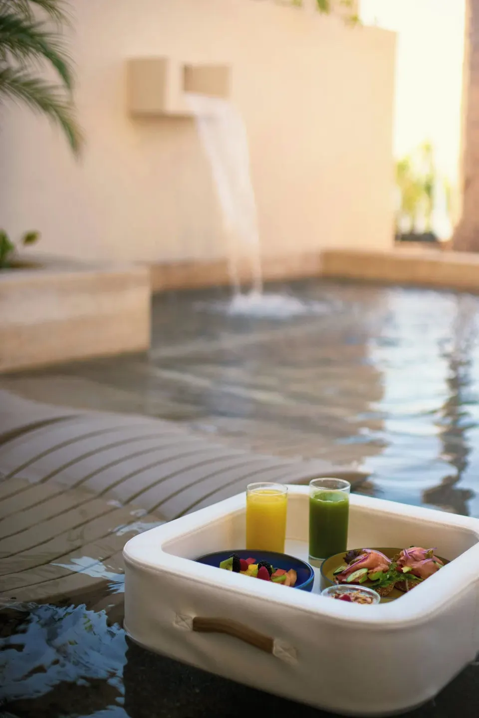 Floating breakfast tray by an oceanfront room pool at Marriott Puerto Vallarta Resort & Spa.