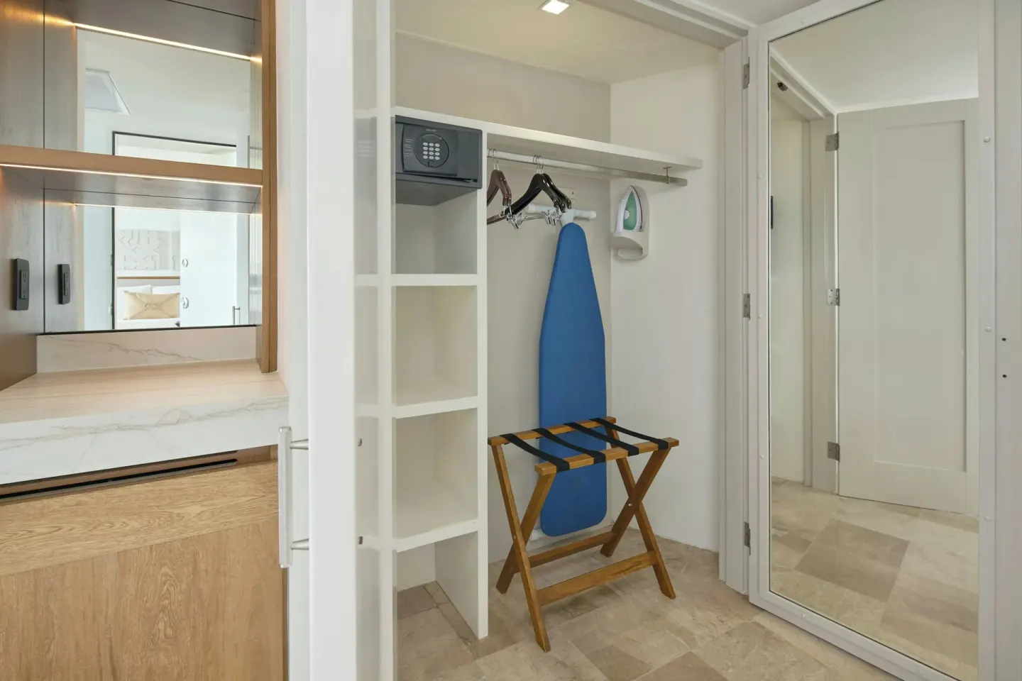 Guest room closet with safe, ironing board, and luggage rack at Marriott Puerto Vallarta Resort & Spa.