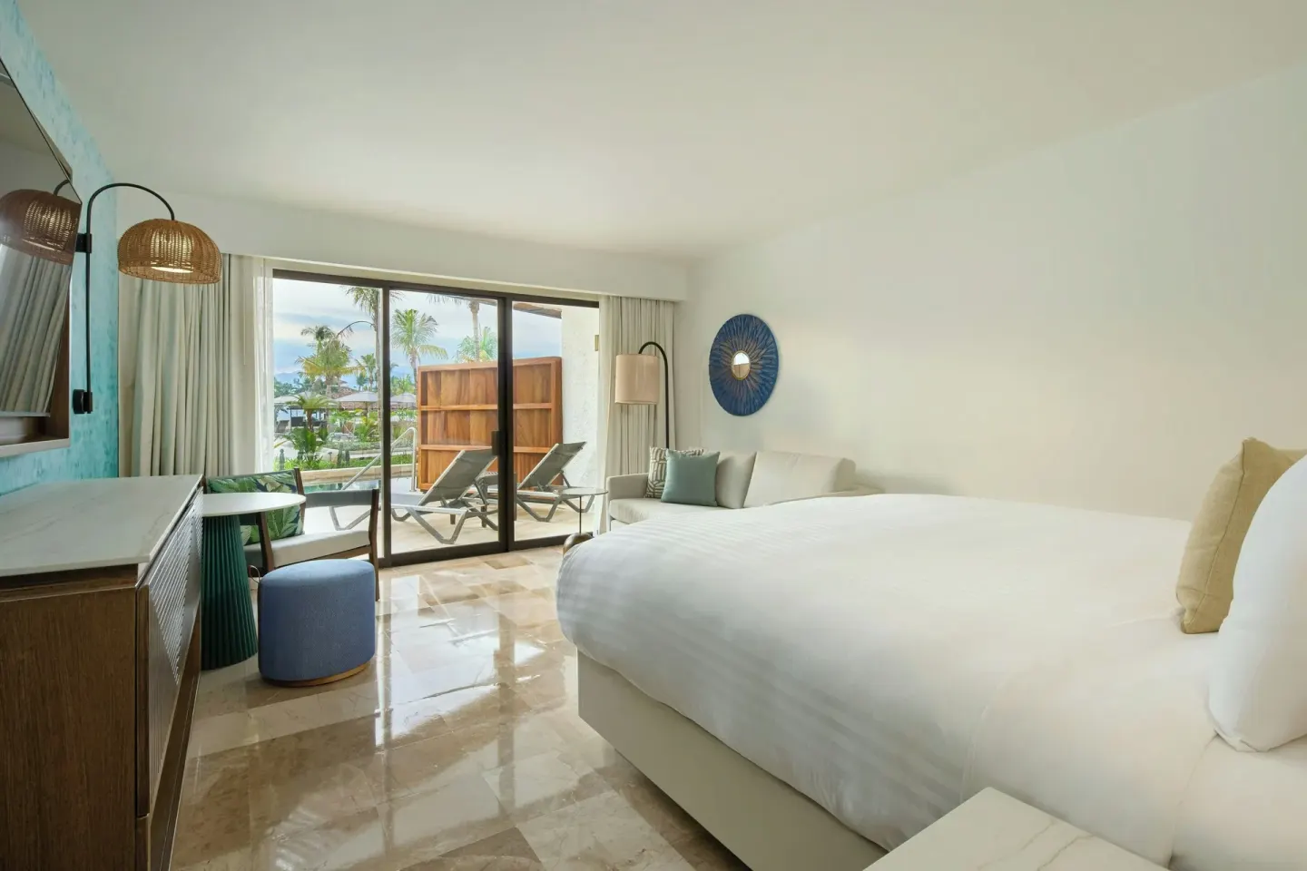 Room with sofa bed and patio at Marriott Puerto Vallarta Resort & Spa.