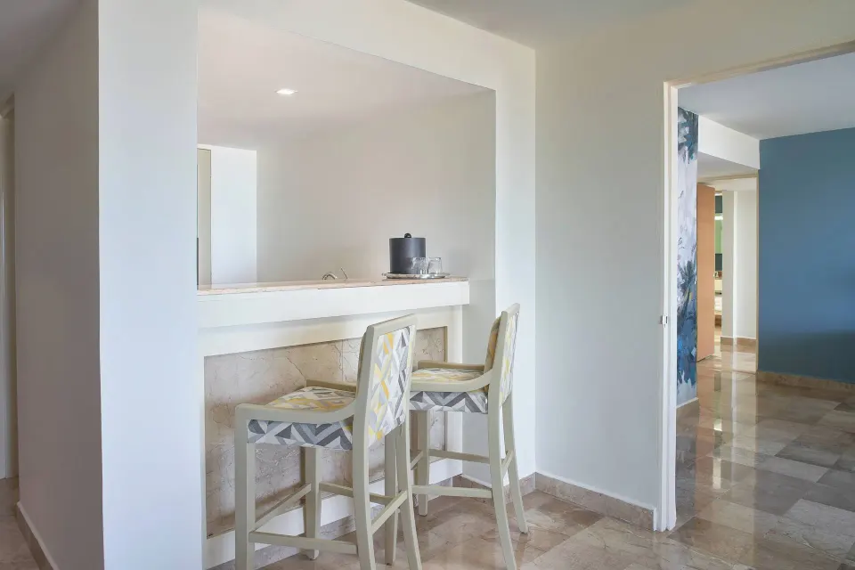 Oceanfront one-bedroom suite bar counter at Marriott Puerto Vallarta Resort & Spa with two stools.